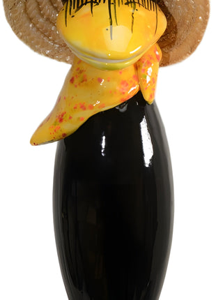 Raven with and straw hat and yellow scarf from Goose and Company