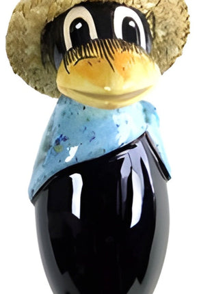 Raven with and straw hat and light blue scarf from Goose and Company