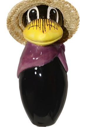 Raven with and straw hat and purple scarf from Goose and Company