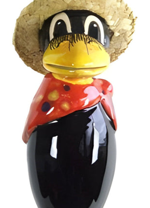 Raven with and straw hat and red base scarf with polka dots from Goose and Company